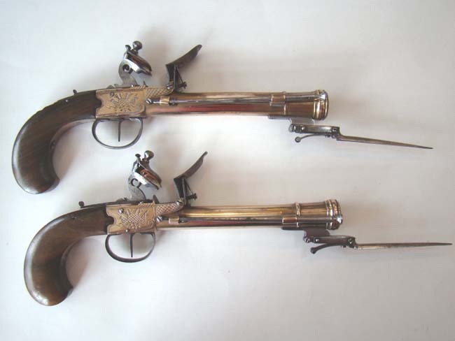 A Unique Large Pair of Unmarked, probably British, Engraved Brass Flintlock Blunderbuss Pistols with snap bayonets. Circa 1780-1800. — image 4
